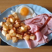 Ham, Crispy Potatoes and Fried Egg With Brown Sauce