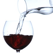 Half Glass of Wine in a Tumbler of Water