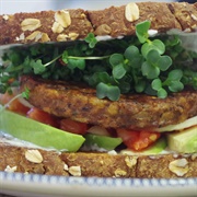 Sandwich With Vegan Burger Patty, Vegetables and Sprouts