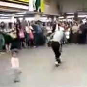 Breakdancer Kicks Baby