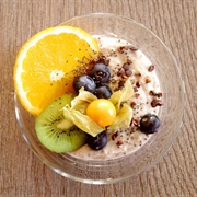 Vegan Porridge With Kiwi, Orange, Blueberries and Physalis