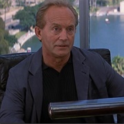 John Milton (Lance Henriksen)
