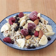 Vegan Müsli With Banana, Almonds and Frozen Raspberries