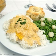 Chicken Oranges Creamy Sauce Serviced Over Pearly White Grain