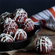 Chocolate Glazed and Cream-Filled Pumpkin Round Donut With Vanilla Drizzle