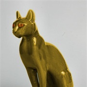 Paired Brass Guard Cats