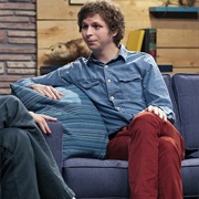4. Michael Cera Wears a Blue Denim Shirt & Red Pants