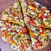 Tomato, Mozzarella, Pesto, Marinated Artichoke and Chickpea Pizza