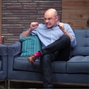 18. Rob Corddry Wears Tan Dress Shoes & Red Socks
