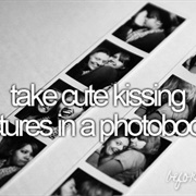 Take Cute Kissing Pictures in a Photobooth