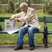 Reading on Park Bench