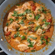 Salmon With Creamy Garlic Prawns and Tomatoes