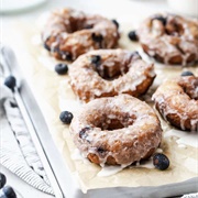 Blackberry-Filled Cinnamon Sugar Blueberry Roll Donut With Sugarplum Drizzle