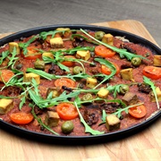 Vegan Tofu Olive and Arugula Pizza