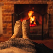 Sit Under Blanket by Fire