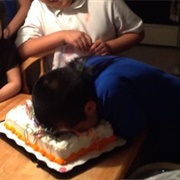 Pushing Someone's Face Into a Cake