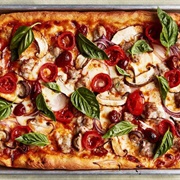Pepperoni, Italian Sausage, Mushroom, and Bell Pepper Pizza (Romano Quartet)