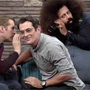 1. Ty Burrell Wears a Chambray Shirt & Clear Frame Glasses