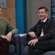 26. Tom Lennon Wears Black Slacks and a Black Skinny Tie