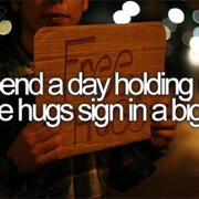 Spend a Day Holding Free Hugs Sign