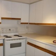 White Laminate Cabinets With Wood Trim