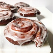 Vanilla Iced and Cream-Filled Pumpkin Roll Donut With Orange Drizzle