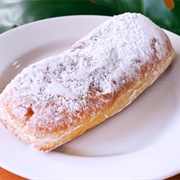 Chocolate-Filled Powdered Sugar Long John With Marshmallows