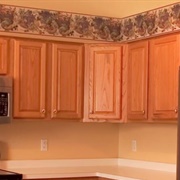 Orange-Hued Wood Cabinets