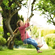 Pumping High on a Board Swing