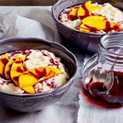 Milchreis (German Cold Rice Pudding) With Mango and Cranberry