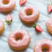 Strawberry Iced and Strawberry-Filled Ring Donut With Strawberry Drizzle