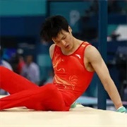 Su Weide of China Takes Two Falls on Horizontal Bars at the 2024 Paris Olympics