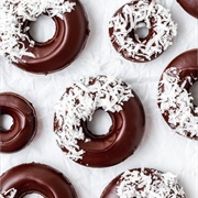 Rose Iced and Chocolate-Filled Chocolate Ring Donut With Coconut