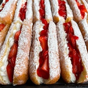 Strawberry Iced and Strawberry-Filled Long John With Strawberry Drizzle