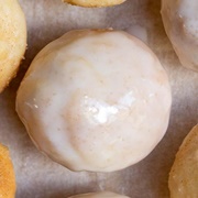 Vanilla Iced and Cream-Filled Round Donut With Strawberry Drizzle