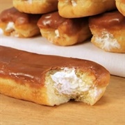 Apricot Iced and Whipped Cream-Filled Long John With Marshmallows