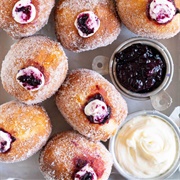 Whipped Cream-Filled Cinnamon Sugar Blueberry Round Donut With Crushed Oreos