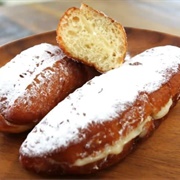 Apricot Iced and Cookie Dough-Filled Red Velvet Long John With Banana Drizzle