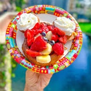 Mickey Waffle With Chocolate-Hazelnut Spread, Bananas, Berries, and Whipped Cream