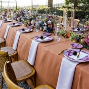 Napkins Draped Under Plates
