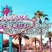 Take a Picture Under Las Vegas Sign