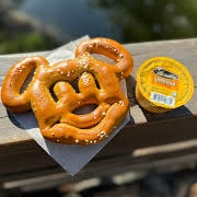 Mickey-Shaped Pretzel With Cheese Sauce