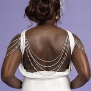 Beading Draped Over Arms and Across Back
