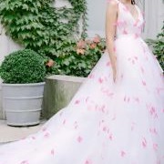 Colored Feathers Scattered Over Dress