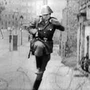 Conrad Schumann Jumping a Barbed-Wire Fence During Construction of the Berlin Wall