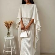 Smooth Cape Over Pleated Dress