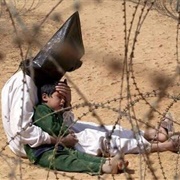 An Iraqi Man Comforts His Four-Year Old Son at a Holding Center for Prisoners... (Jean-Marc Bouju)