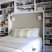 Bookshelves All Around Bed