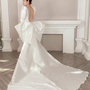 Satin Bow Flowing Into Train