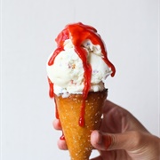 Soft Serve Cone With Strawberry Sauce